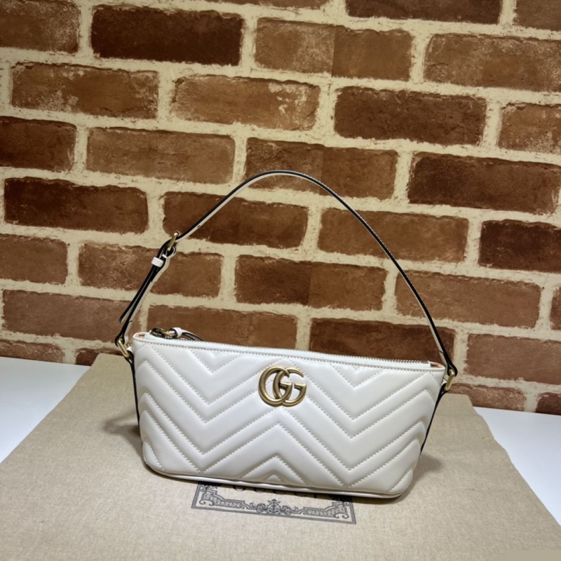 G*u*i top handle bags